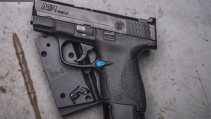 Tyrant Designs M&P Shield Extended Magazine Release left profile