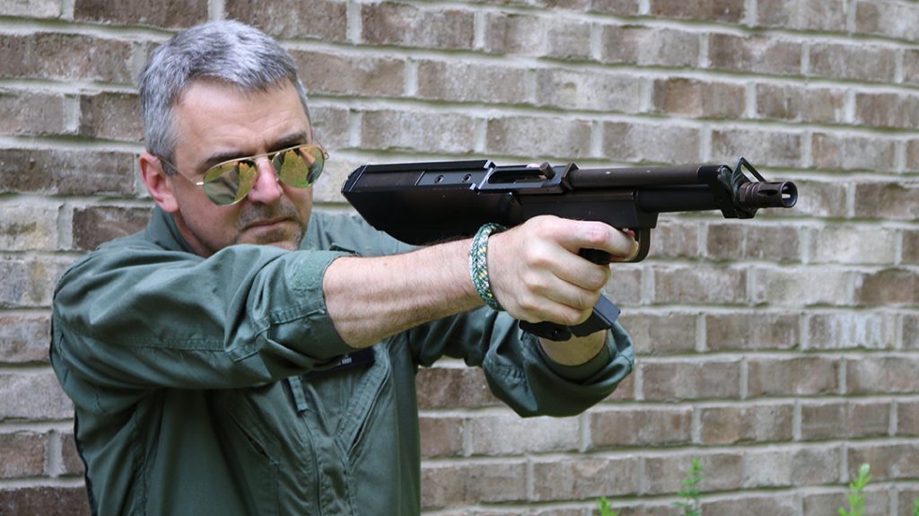 The safety on my gun is a sliding switch tucked inside the triggerguard. Some variations had this device mounted back in the receiver assembly in the manner of an M16.