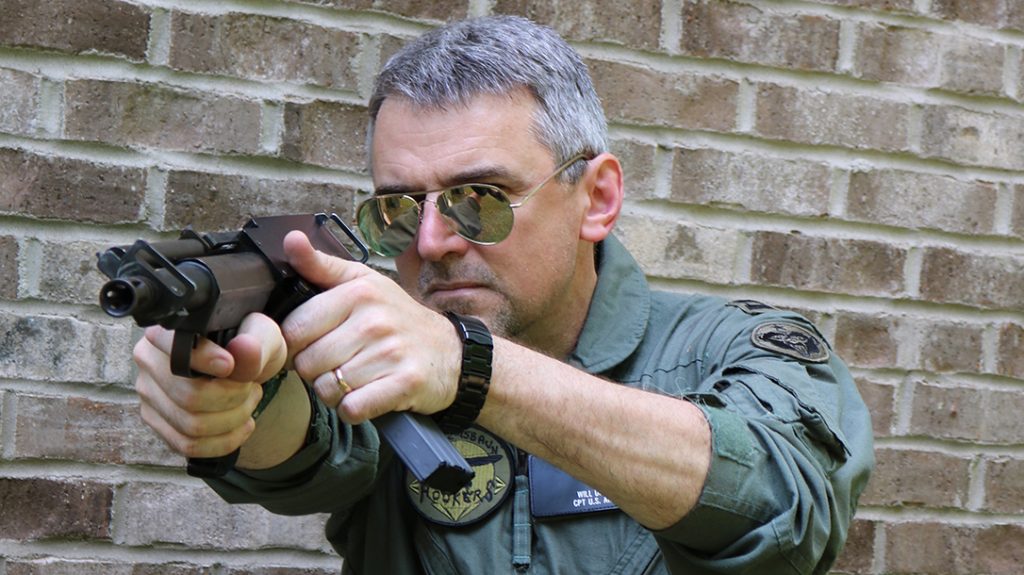 The Bushmaster Arm Pistol was an ambidextrous bullpup survival pistol that ejected out the top. The steel stud behind the ejection port is the reciprocating charging handle.