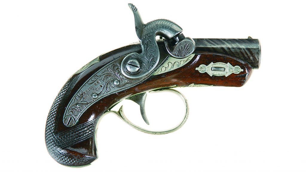 This exquisite Philadelphia Deringer reveals the simulated Damascus, browned and striped barrel, and checkered walnut stock. 