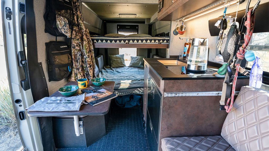 The Altitude Bed lowers, and the lounge area converts to a bed for a sleeping area fit for four people.
