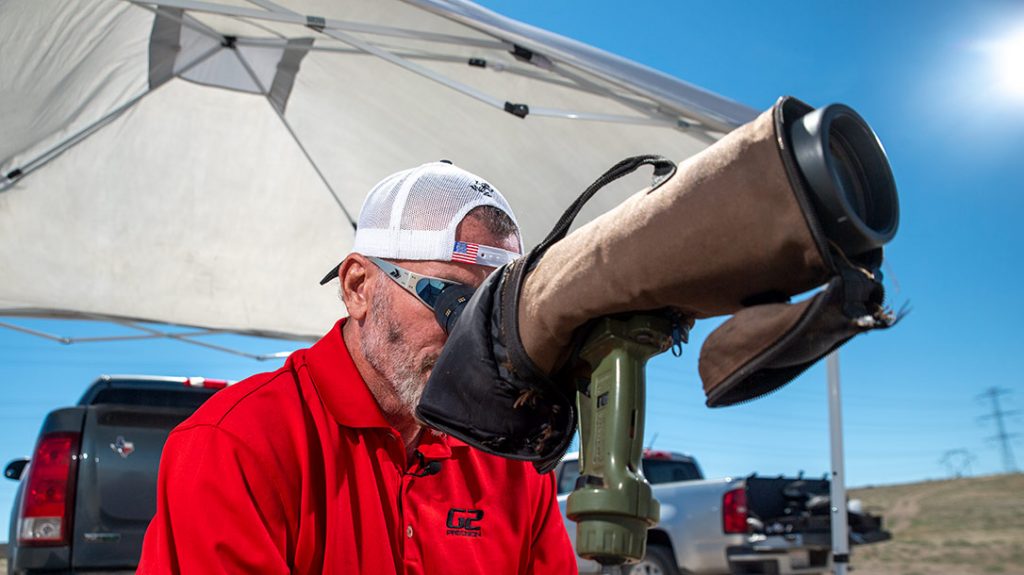 Charlie spots for a shooter.