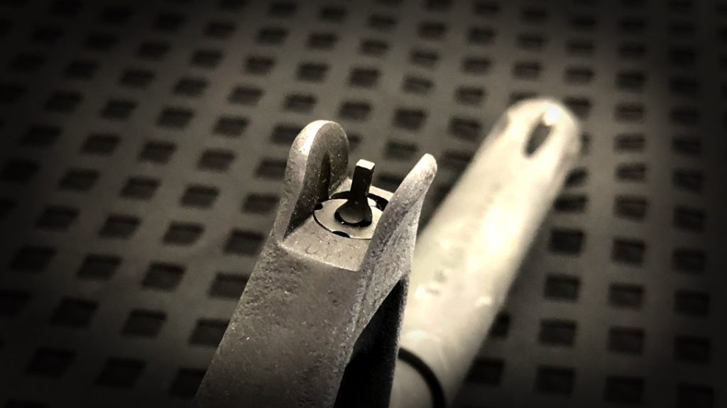 An adjustable front sight.