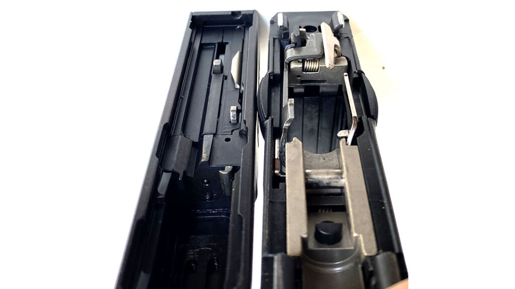 Inside you’ll find the engineering genius of Wilhelm Bubbits. Note the multi-piece slide showing the recess for the barrel’s top-rear positioned locking lug. On the polymer frame you can see the barrel retaining pin that holds the whole gun together.