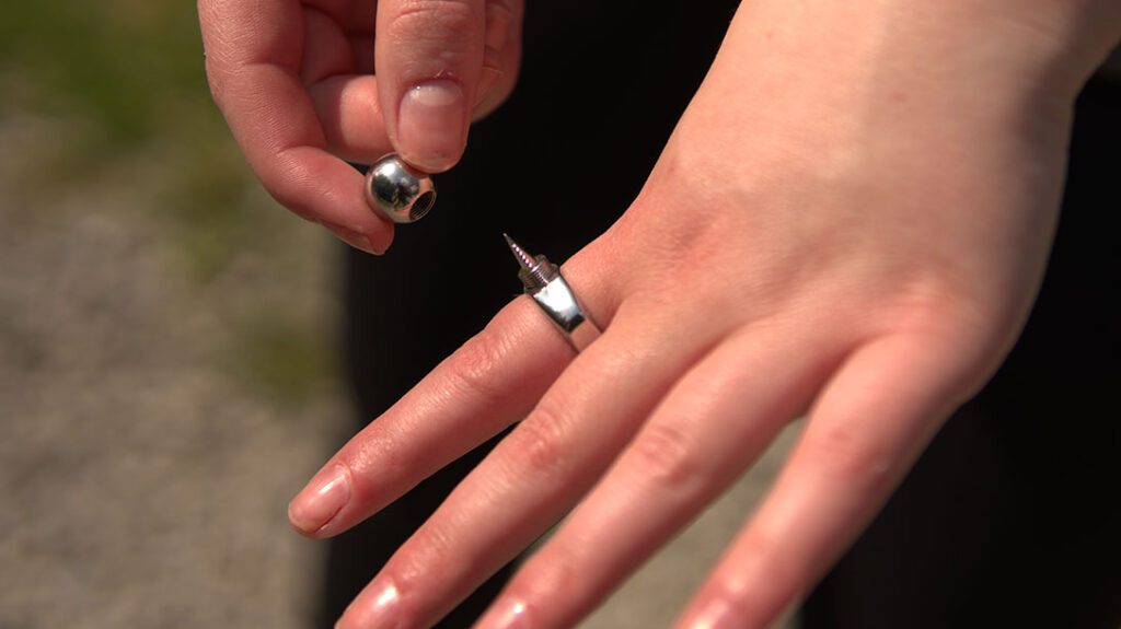 Like the Chrome, to reveal the blade on the Luna self-defense ring, unscrew the top.