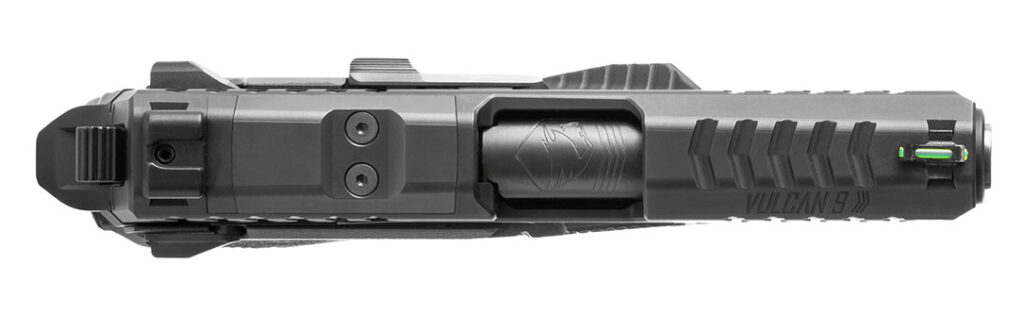 From the top can be seen the fiber-optic front sight, cross-over front serrations, ejection port, optics-cut cover-plate, and square-notch rear sight.