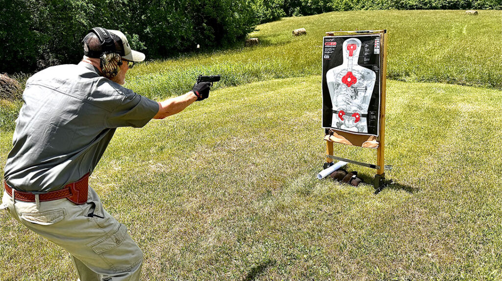 At 3 yards, the author engages this Thompson B27 STOP target with anatomical features and immobilization zones; he scored 265/300 on a 30-round course.