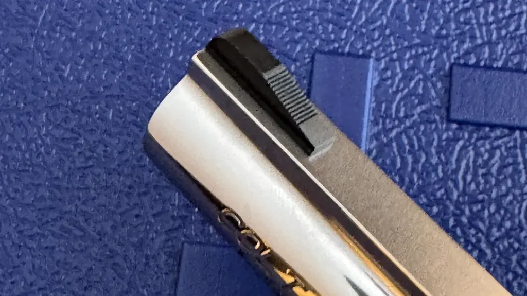 Black serrated front ramp site on the colt Viper.