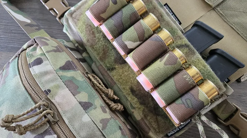 Shotgun shell holder mounted to a tactical vest.