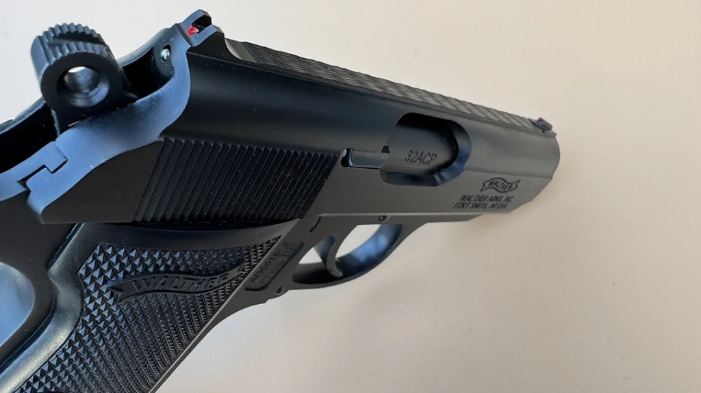 The minuscule fixed sights are the same but now have red dots on the front sight and just below the rear sight notch.