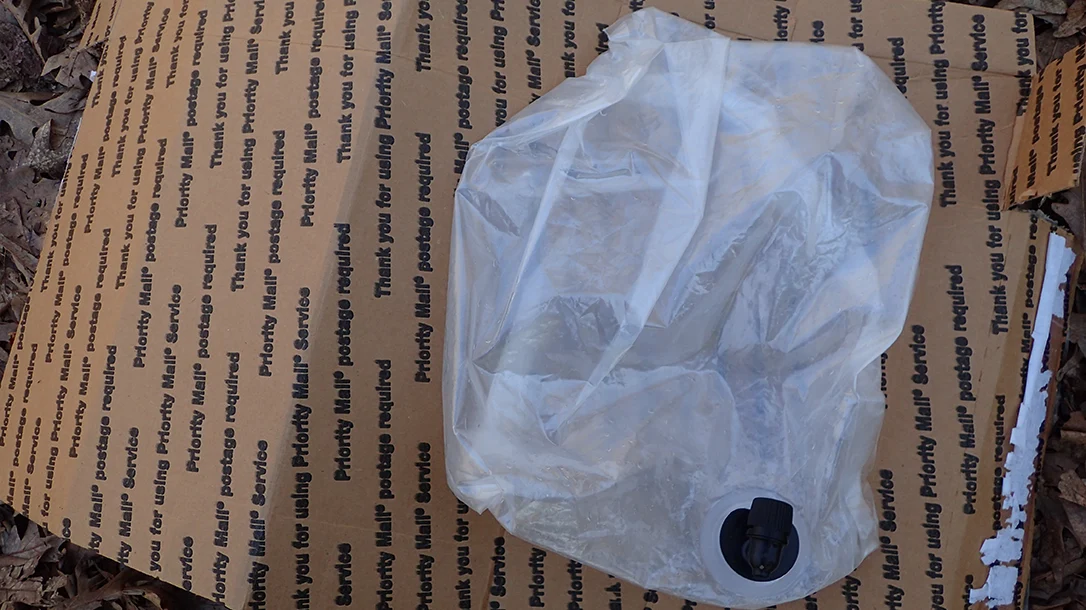 Using cardboard and an empty boxed wine bag creates an excellent sleep system that offers both insulation and comfortable urban pillow support.