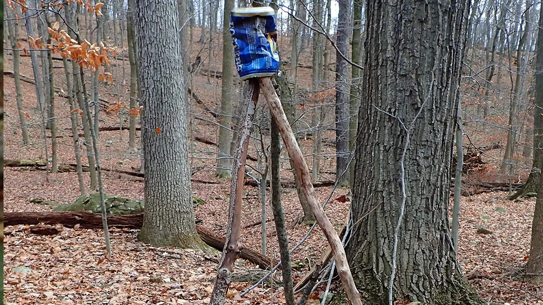 The author found a junk Foster’s Beer can and used it to create a tripod with three pieces of wood, making it a great choice for the project.