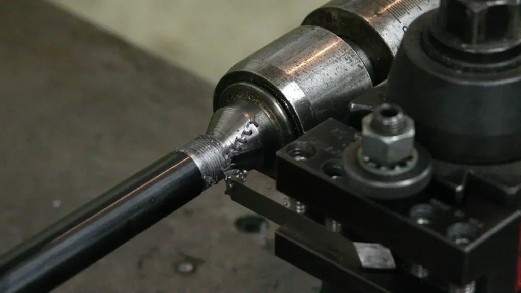 Turning down the barrel, adding threads.