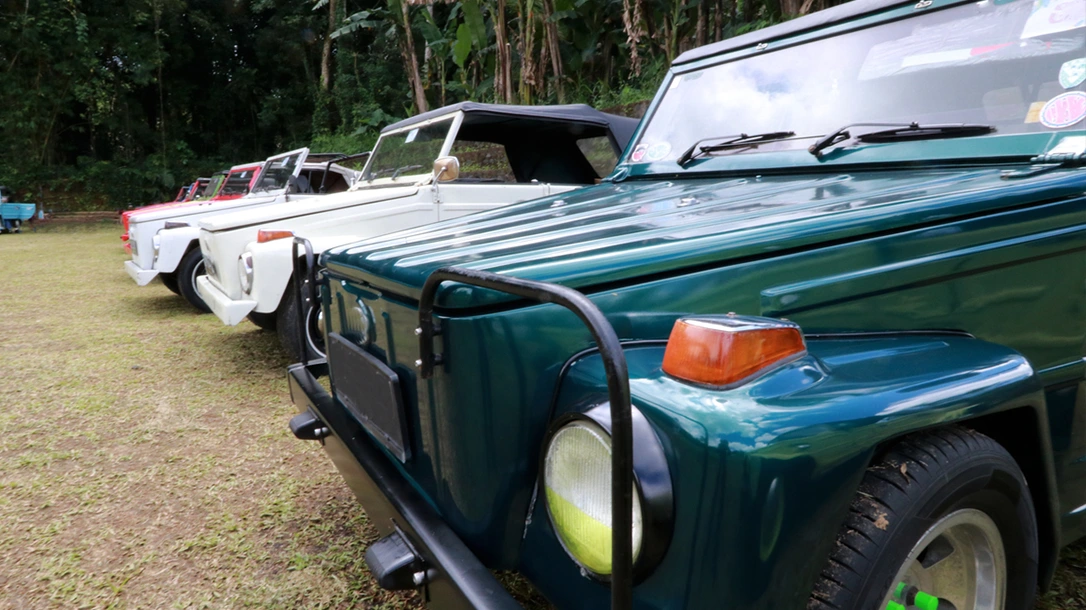 The VW Thing, with its distinctive boxy shape and retro styling, stands out on any road.