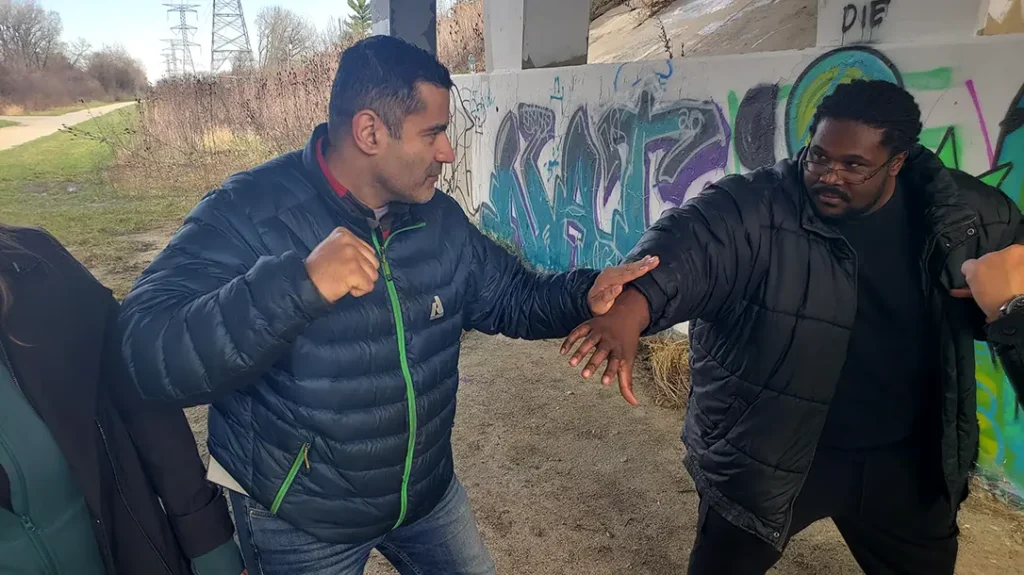 How to Throw a Punch: Kysean decides to jump in and grab Thomas. So, Thomas does a simple palm block/ parry on Kysean’s forearm.