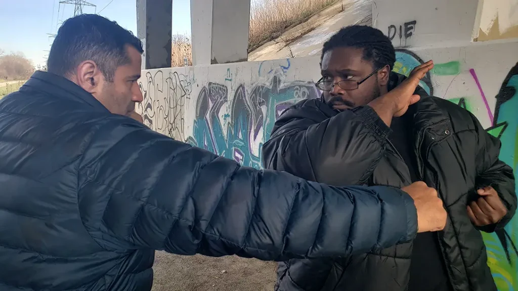 How to Throw a Punch: Kysean retracts his right hand into a knife hand chamber.