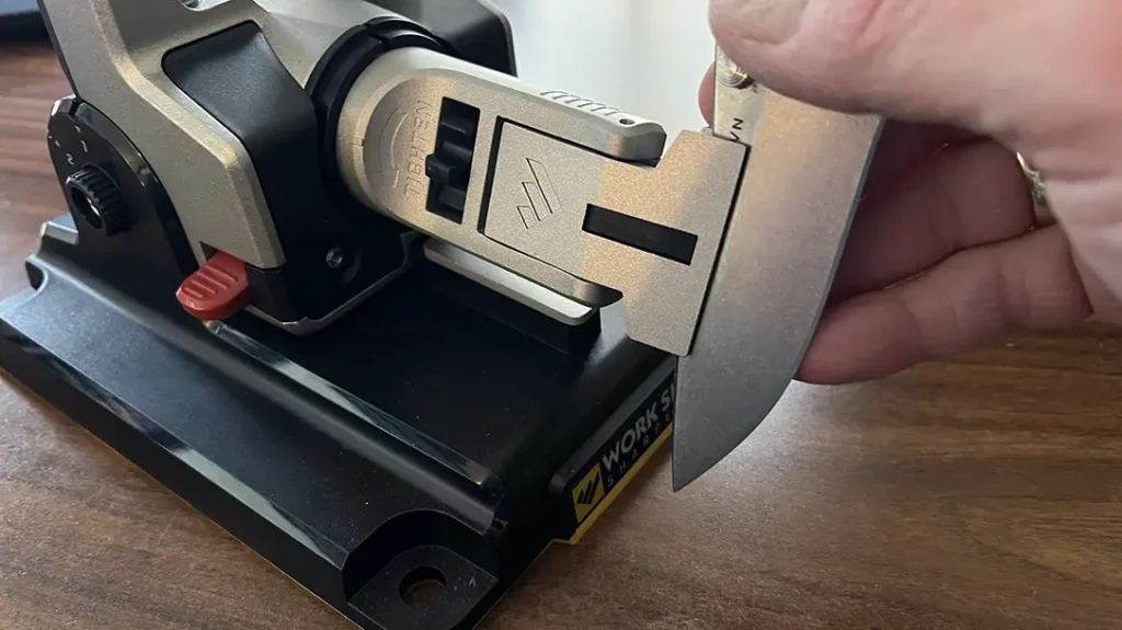 Rotate the V-Block Clamp to get the other side of the blade before moving to the next abrasive.