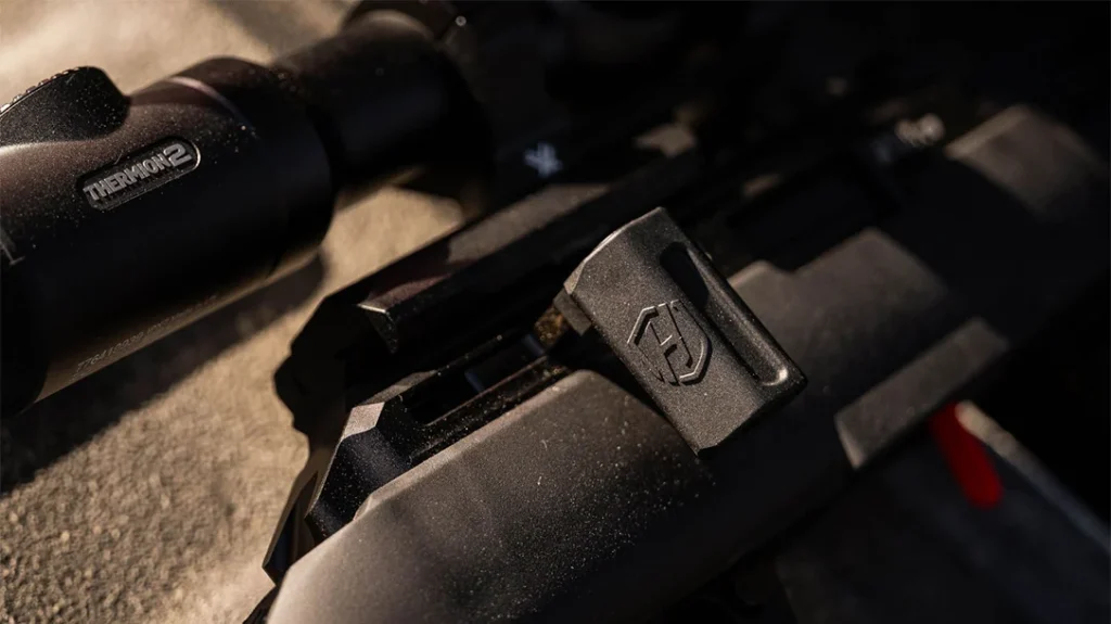 The rifle features a toggle-lock action.