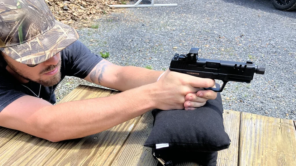 A red dot-equipped handgun is an enhanced handgun. Here, the SAR USA SOCOM Compact is equipped with a Cyelee CATG Pro green dot optic.