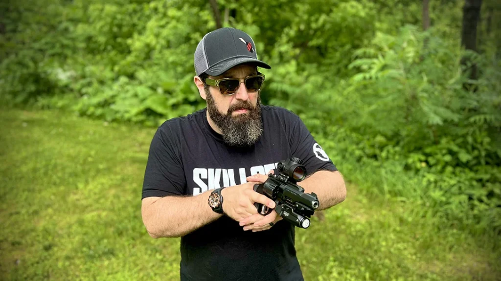 The author shooting the Smith & Wesson Performance Center TRR8.