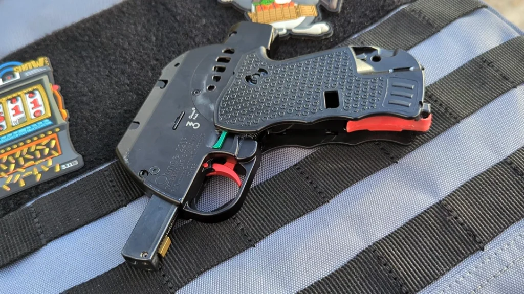 The Ounce is a folding, semi-automatic, recoil-operated, locked-breech, bullpup pistol.