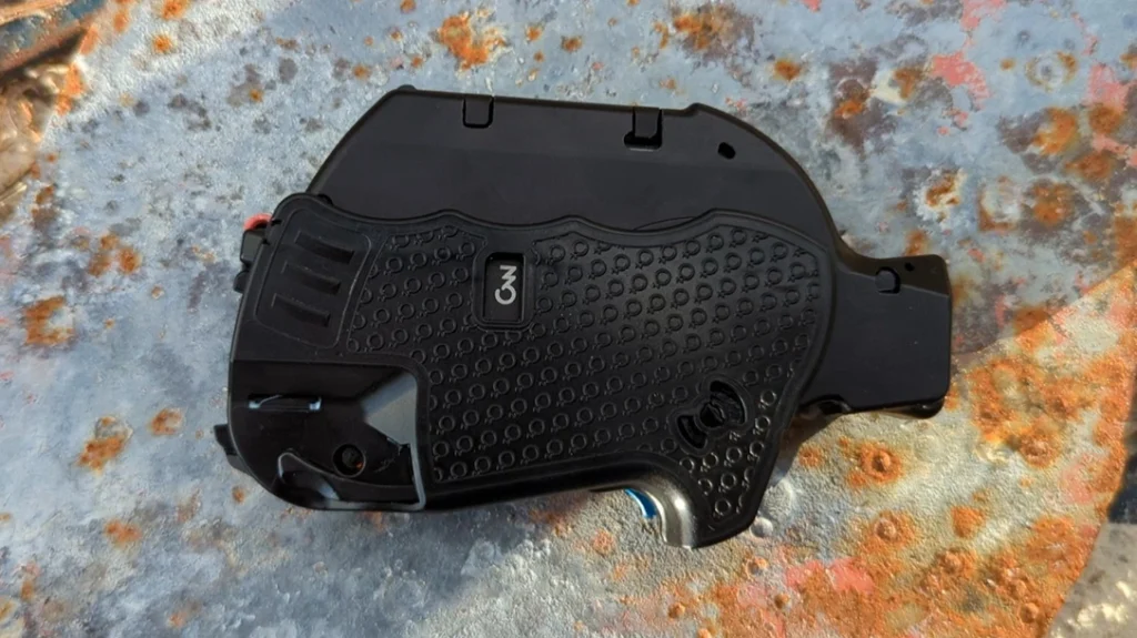 The frame, barrel, and magazine all fold into the pistol grip. This creates something that resembles a vape.